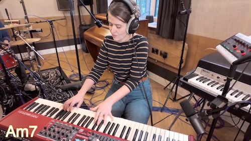 Lucy Hackett playing keyboard